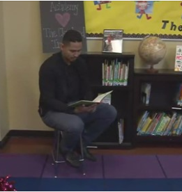 Carlos Carrasco reads “If You Give A Mouse A Cookie” to  students