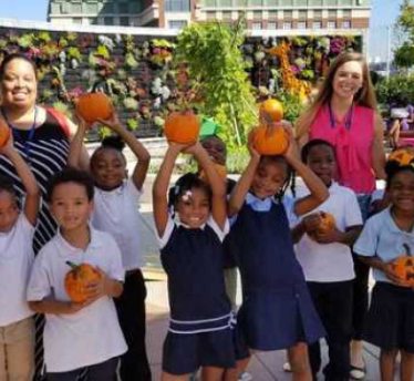 Students deliver hand decorated pumpkins to children’s  hospital